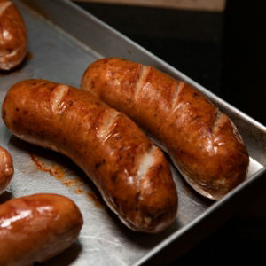 brown-sausage-on-stainless-steel-tray.jpg brown sausage on stainless steel tray